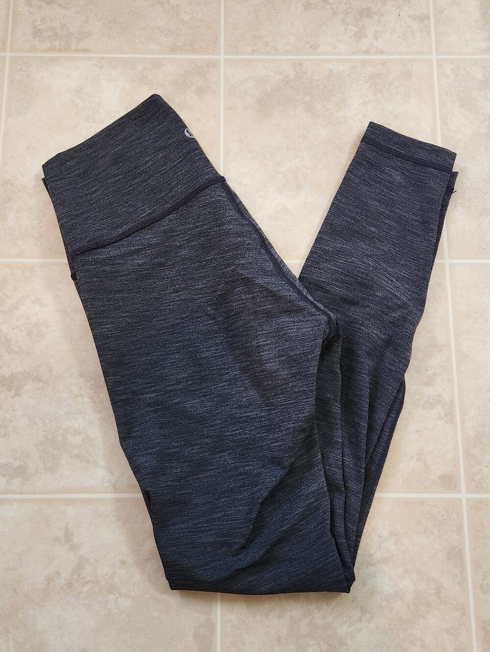 Lululemon high-rise leggings in a heathered black and grey